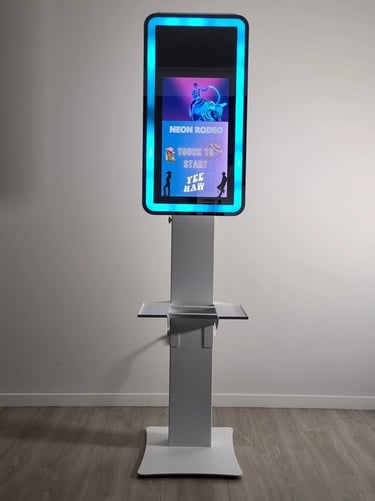 DSLR mirror photo booth with a 21.5 inch touch screen and LED lit mirror face used for events across the Redlands.