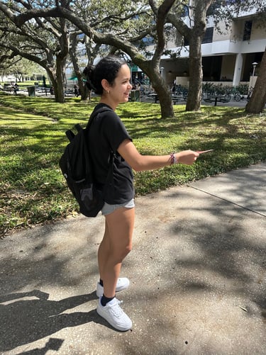 Student handing out flyers on campus