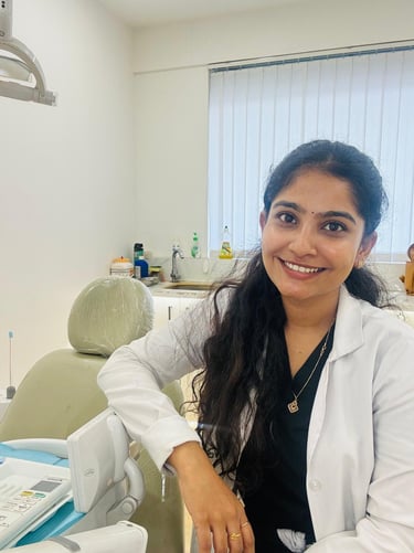 a woman in a white lab coat and a laptop