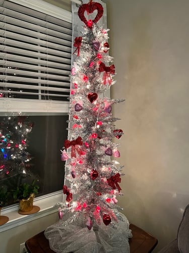 Silver metallic Skinny tree with Valentine's Day Decorations: Hearts, Bows, Heart lights.