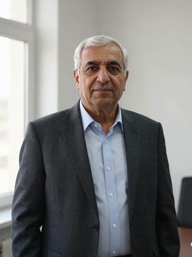 Portrait of a senior Afghan monitoring and evaluation specialist in Kabul, professional attire, soft natural window light, documentary editorial style.