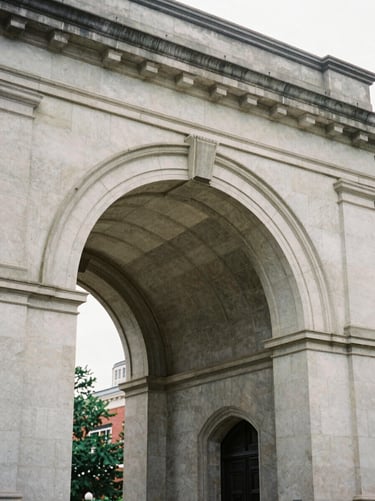 Close-up of a classic stone archway of a prestigious East Coast university, soft overcast light, architectural detail