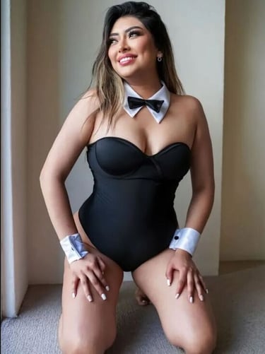 a woman in a black bathing suit and bow tie
