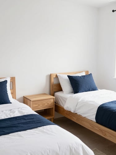 Bright, tidy bedroom with two twin beds, two wooden nightstands, clean white walls, natural daylight, 35mm