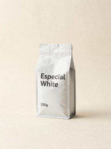 Minimalist studio photo of Especial White coffee bag, 250g, textured cream background, warm earth tones, editorial composition