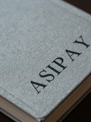 Macro crop of linen-bound book cover with minimalist typography, cool gray undertones, soft side lighting.