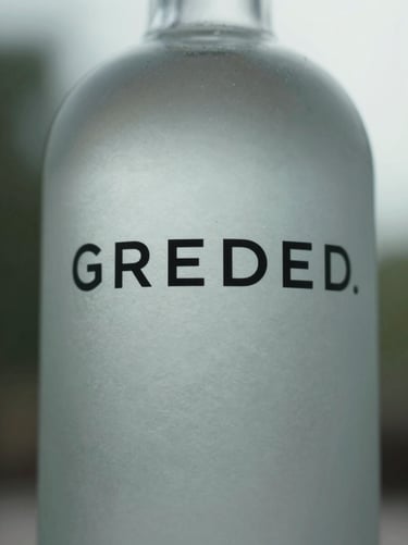 Close-up of premium matte glass bottle with minimalist black typography, cool diffused daylight.