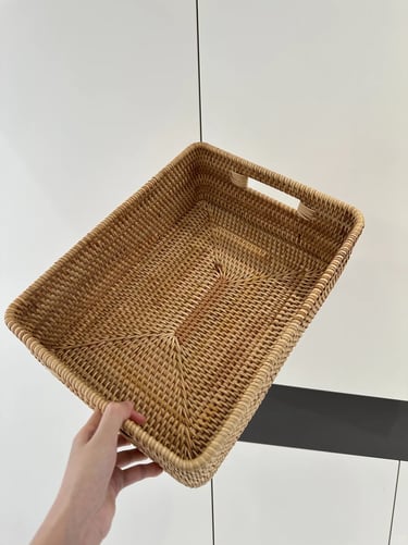 Woven storage basket for organizing cat toys and small pet essentials in a calm modern home.
