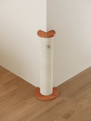 Freestanding sisal cat scratching post with wooden top and base in a clean small apartment corner.