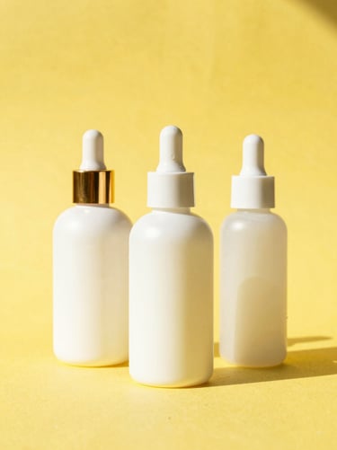 Bright high-key studio photography of premium cosmetic bottles on a sunny yellow background under direct afternoon sunlight