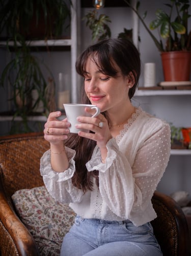 a woman which is happy with her coffee
