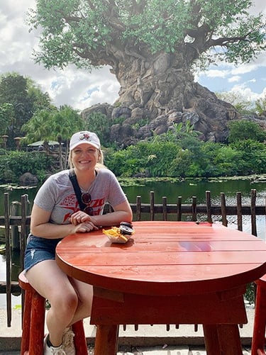 Kasey Kalk pictured with her husband in front of the Tree of Life at Disney's Animal Kingdom®.