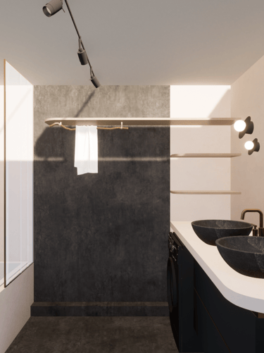 Salle de bain après transformation avec du carrelage gris foncé et des teintes de beige et doré