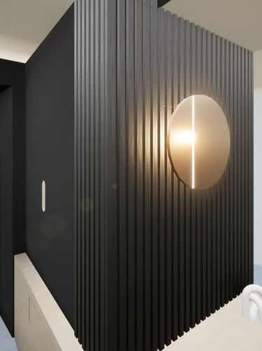 Zoom sur le projet de transformation de l'espace d'entrée avec un mobilier sur mesure noir et bois