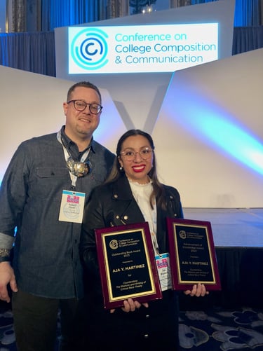 a man and woman standing next to each other holding awards