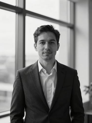 Editorial black and white portrait of a male venture capitalist, modern architectural background, soft window light, professional, 35mm