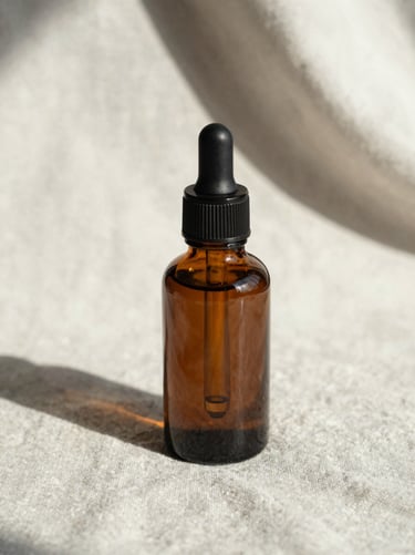 Close-up of a dark amber dropper bottle on a light linen fabric, soft morning shadows, architectural composition