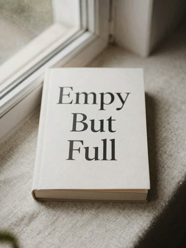 Book cover of Empty But Full resting on natural linen, soft morning window light, muted earth tones.