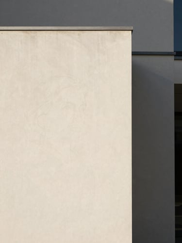 Minimalist architectural portrait of a female legal founder, soft natural daylight, sharp focus, 35mm