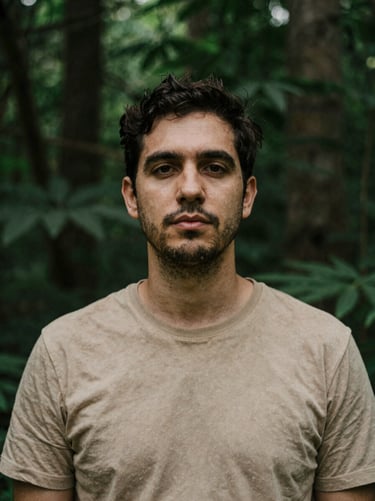 Sober portrait of a male psychologist in natural forest light, organic textures, deep green and sand tones, 35mm lens