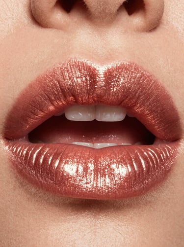 Macro shot of rich rose gold lipstick application on full lips, high-contrast studio lighting, reflective sheen