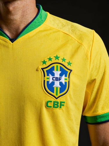 Modern yellow Brazil national team football shirt, focus on CBF crest embroidery, dramatic lighting, sharp details, 50mm lens