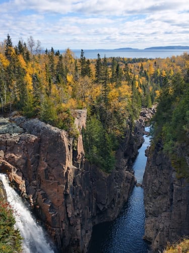 Northern Ontario in the fall overlooking a stream and a waterfall