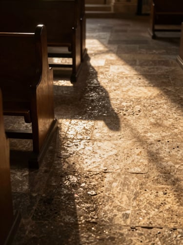 High-contrast shadows of church pews on a textured stone floor, warm golden hour light slicing through.