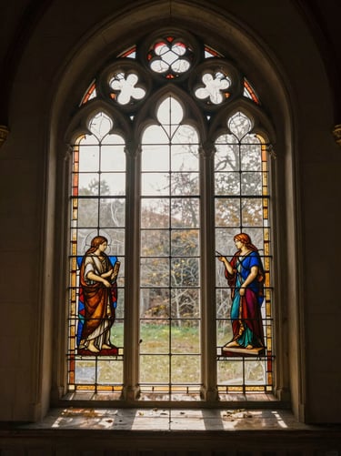 Soft morning light filtering through a dusty stained glass window of an old wooden chapel, warm tones.