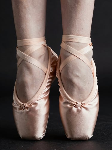 Macro detail of hand-stitched pink satin pointe shoe pleats, soft dramatic studio lighting, 85mm lens