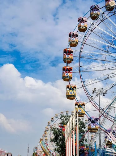 Morning view of giant wheels and amusement rides at Kota Dussehra Mela.