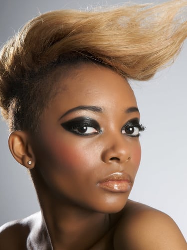 Woman displaying fashion makeup and hair