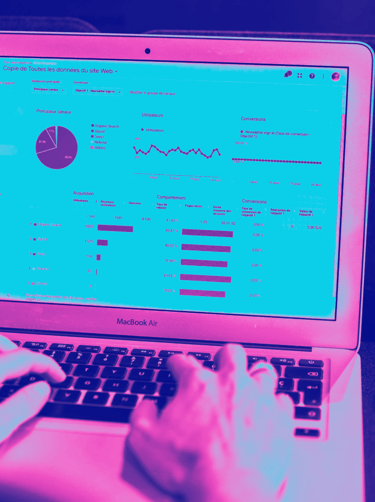 Typing on computer with analytics on webpage