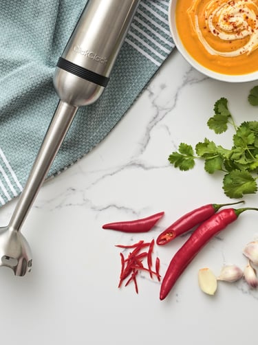 Product photography - a blender with a bowl of soup and ingredients