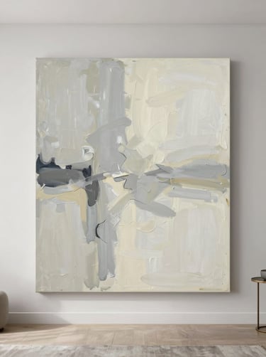 A minimalist abstract painting on a large canvas featuring broad, sweeping brushstrokes in light grey and cream, hanging in a bright, modern North American living room with clean lines.