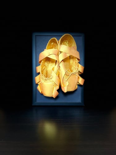 Handcrafted framed pointe shoe artwork with gold ballet shoes
