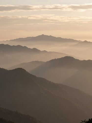 A wide-angle landscape photograph of a misty mountain range at dawn, captured with soft lighting, reflecting colors of taupe and soft cream in the sky, inspired by oil painting textures.