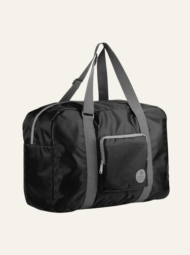 Black foldable travel duffel bag with grey shoulder straps and front zipper pocket for carry-on luggage.