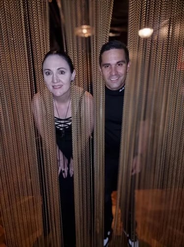 Carly and Kahn with their heads in the hanging chains at the Boom Boom Room Brisbane.