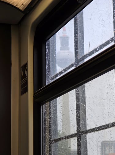 a window with a view of a city skyline