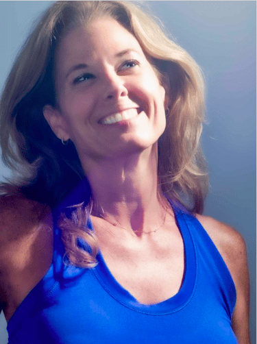 a woman in a blue tank top and a white shirt