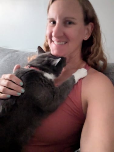 snuggly cat sleeping on their pet sitter