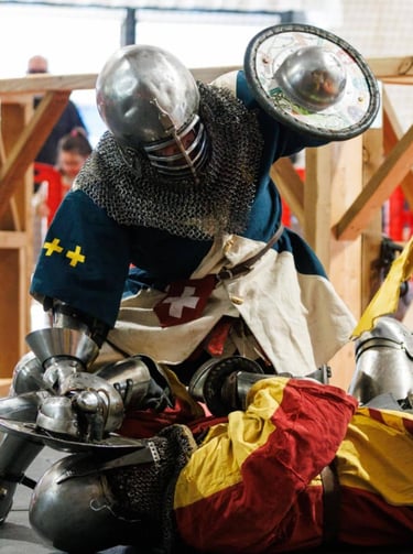 Combat de béhourd dont les adversaires portent des tabards à personnaliser