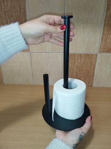 Matte black stainless steel paper towel holder with anti-slip base and top handle, kitchen