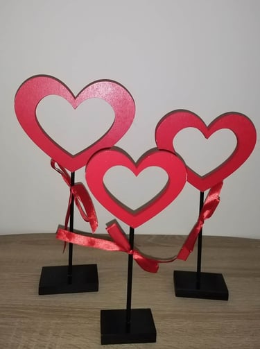 Set of three red Valentine’s Day heart wooden signs on stands, decorative tabletop love accents