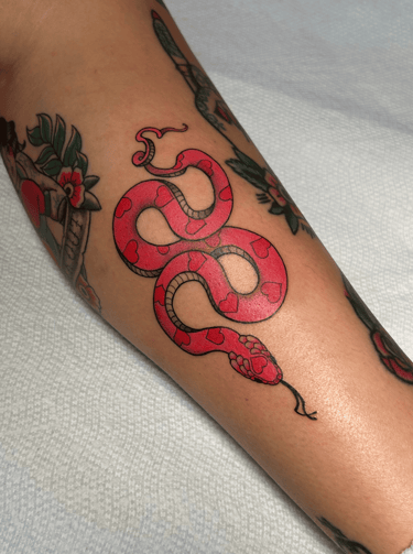 american traditional full color snake feminine tattoo