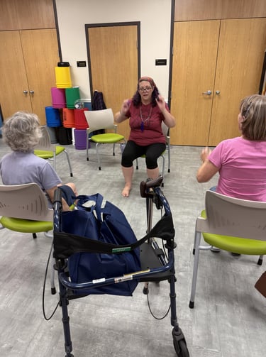 Rachel teaching gentle chair yoga class at Micco library