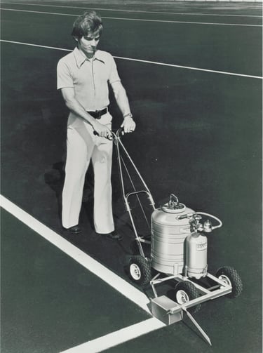 Painting a parking lot with a parking lot paint striping machine