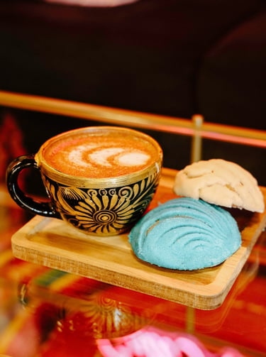 a perfect churro latte hot with cafe con chisme signature conchas