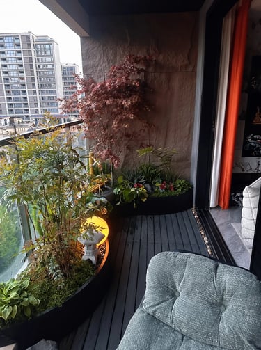 Modern small balcony design with compact seating, greenery, and thoughtful space-saving outdoor deco
